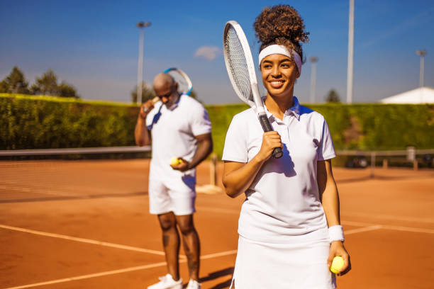 mana and woment playing tennis